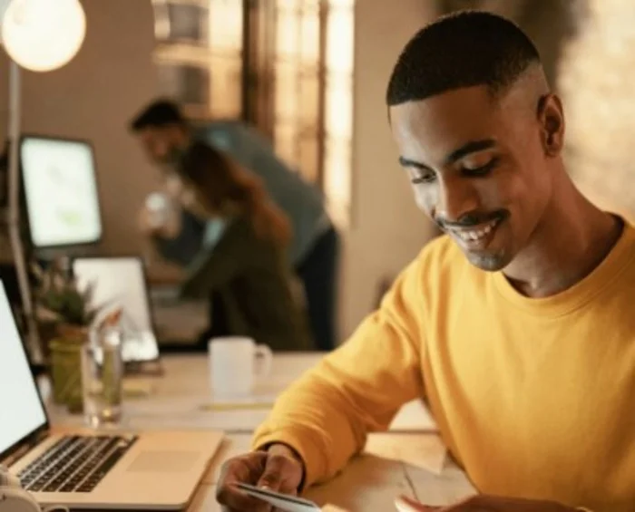Man using SMS for secure Banking